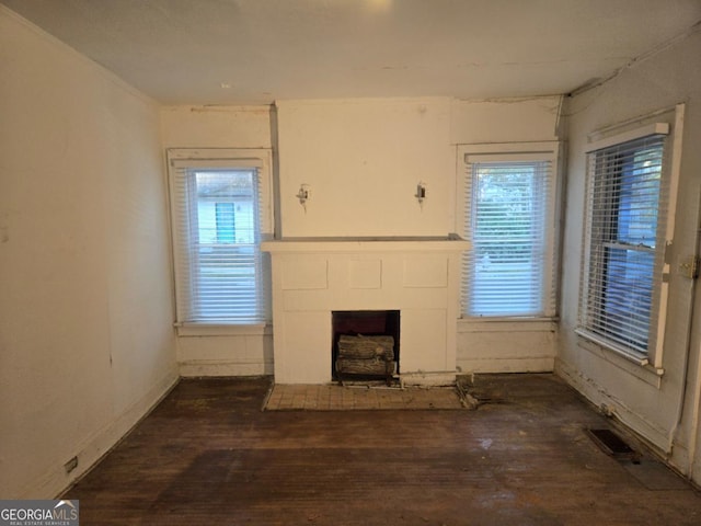 unfurnished living room featuring dark wood-type flooring