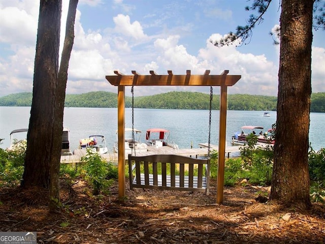 dock area featuring a water view