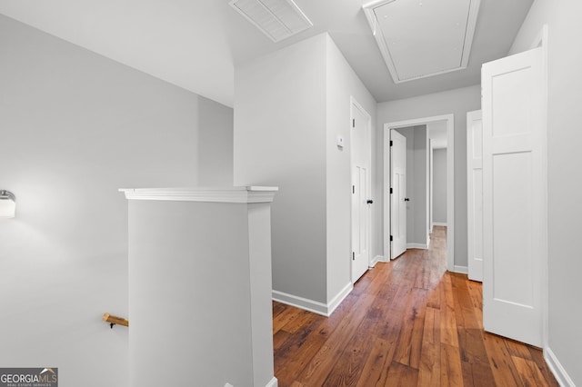 corridor featuring wood-type flooring