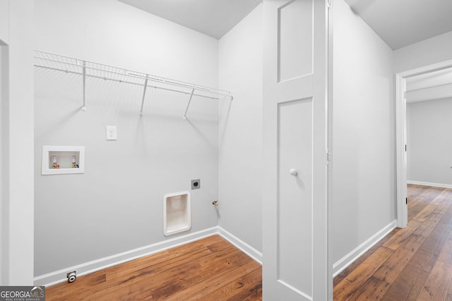 laundry room featuring washer hookup, electric dryer hookup, hookup for a gas dryer, and hardwood / wood-style flooring