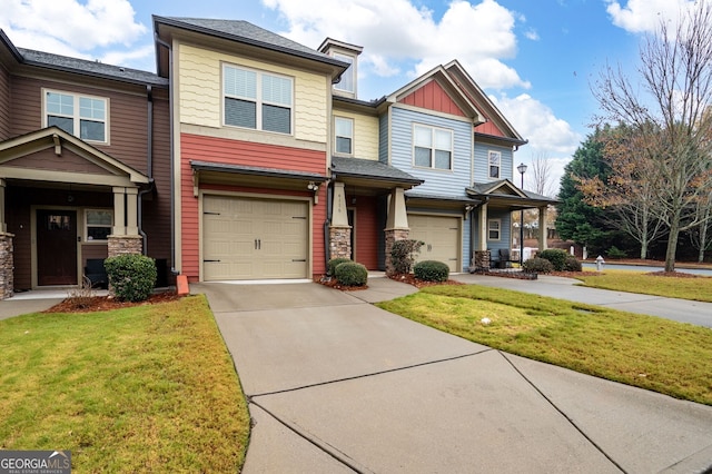 view of front of home with a front yard and a garage