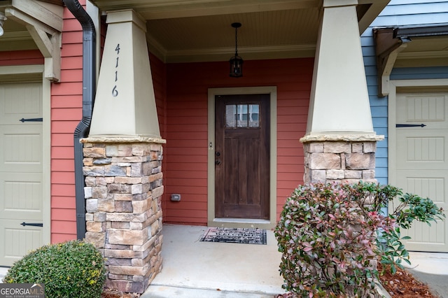 view of exterior entry featuring a porch