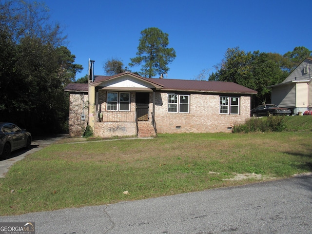 view of front facade with a porch and a front yard