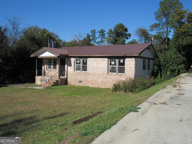 ranch-style house with a front lawn