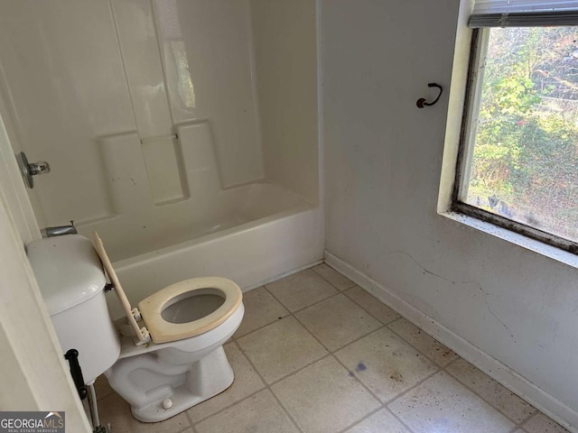 bathroom with tile patterned floors and toilet