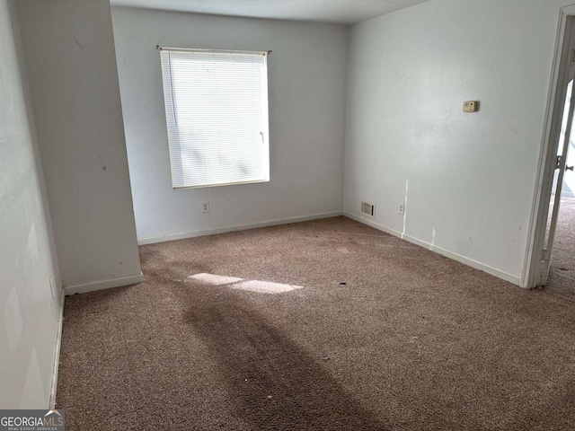 spare room featuring carpet flooring