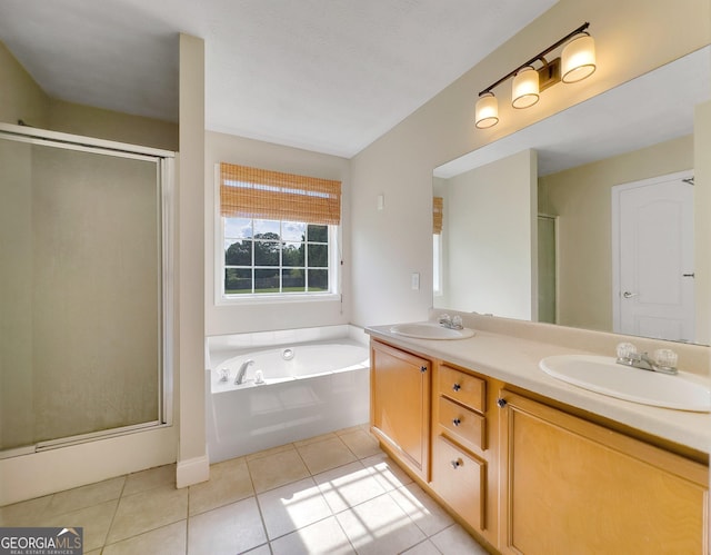 bathroom featuring vanity, tile patterned floors, and separate shower and tub