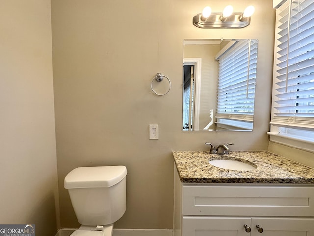 bathroom with vanity and toilet