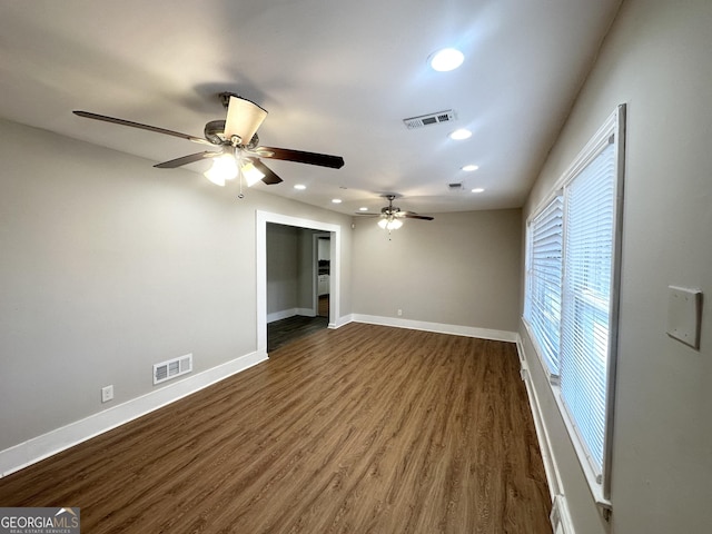 unfurnished room featuring dark hardwood / wood-style floors