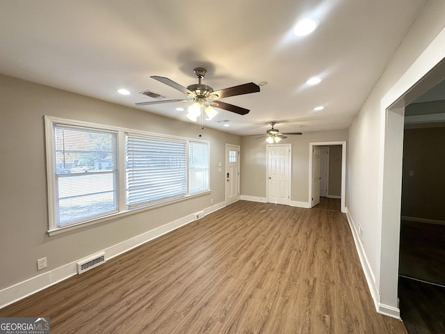 spare room with hardwood / wood-style floors and ceiling fan