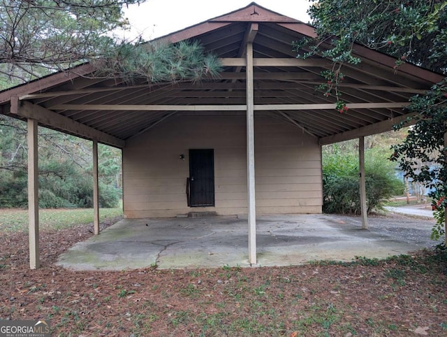 view of parking / parking lot with a carport