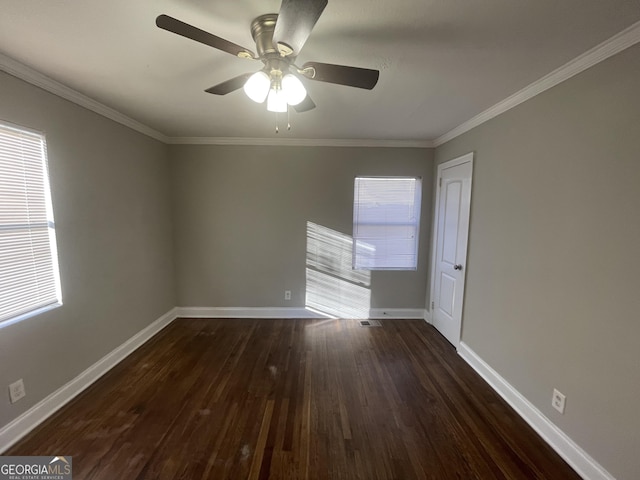 unfurnished room with ornamental molding, ceiling fan, and dark hardwood / wood-style flooring