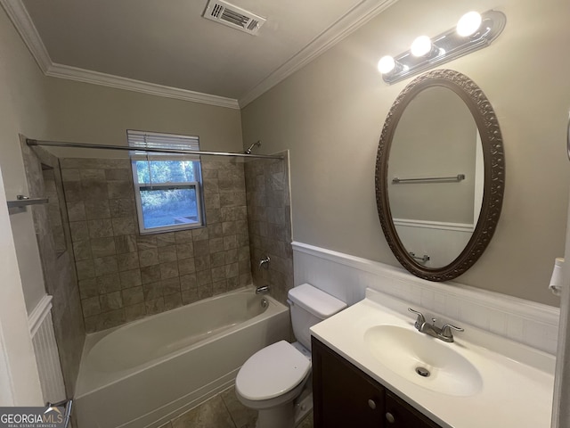 full bathroom with tile patterned flooring, ornamental molding, toilet, vanity, and tiled shower / bath combo