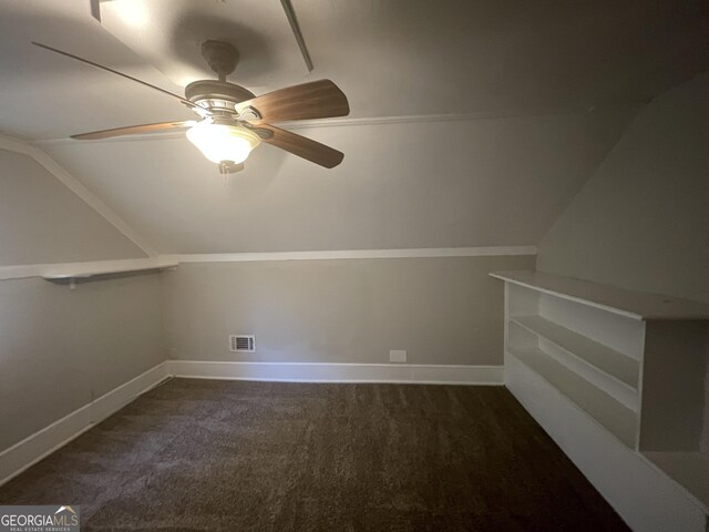 additional living space featuring lofted ceiling, ceiling fan, and dark carpet