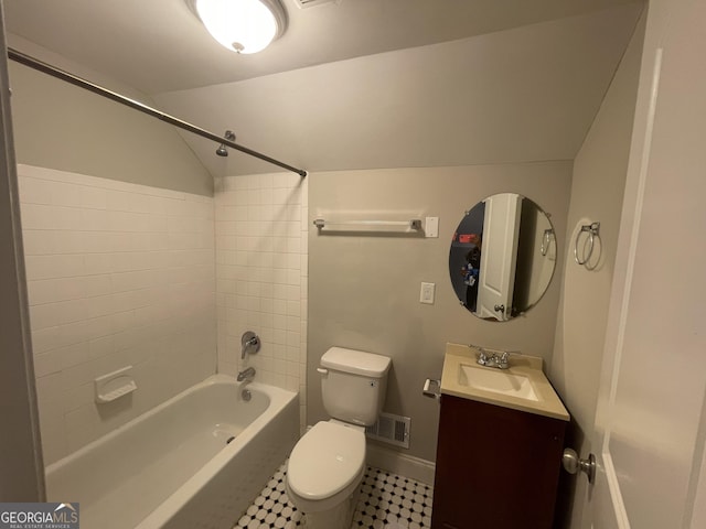 full bathroom featuring toilet, tiled shower / bath, and vanity