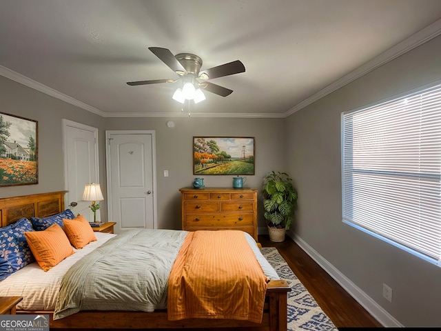 bedroom with multiple windows, ceiling fan, crown molding, and dark hardwood / wood-style floors