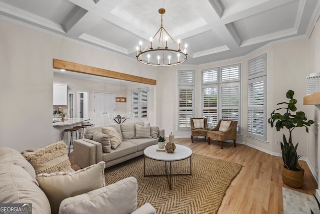 living room with a notable chandelier, light hardwood / wood-style floors, beam ceiling, and crown molding