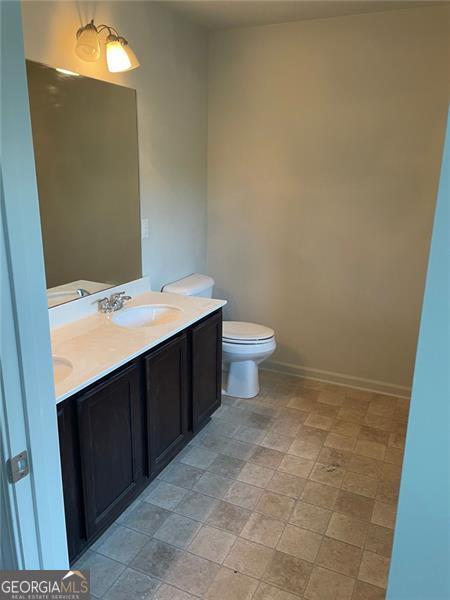 bathroom with vanity and toilet