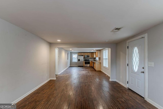 foyer featuring dark wood-type flooring