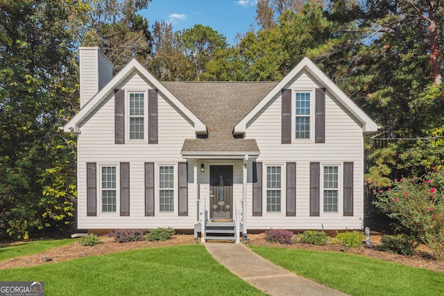 view of front of house with a front lawn