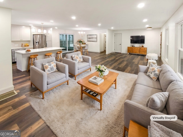 living room with dark hardwood / wood-style floors