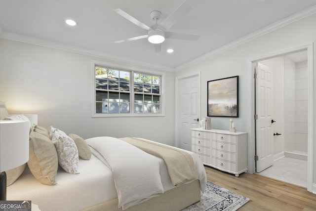 bedroom with ensuite bathroom, ceiling fan, ornamental molding, and light hardwood / wood-style flooring