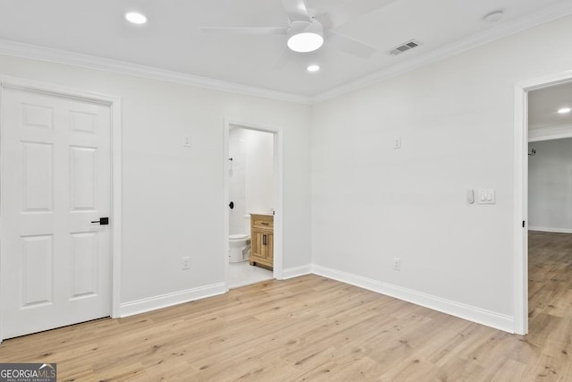 spare room featuring ceiling fan, crown molding, and light hardwood / wood-style flooring