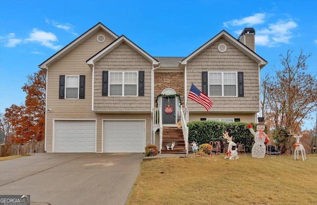 split foyer home featuring a front yard and a garage