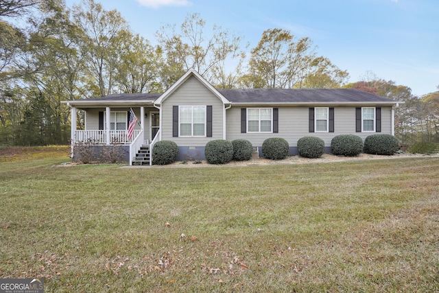 ranch-style house featuring a porch and a front lawn