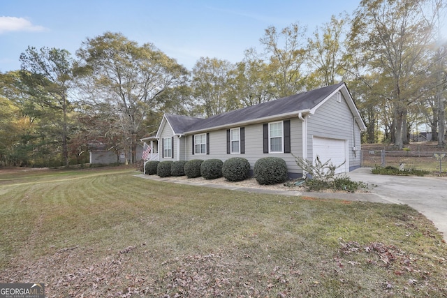 view of front facade with a garage and a front lawn