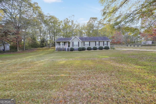 single story home featuring a front lawn