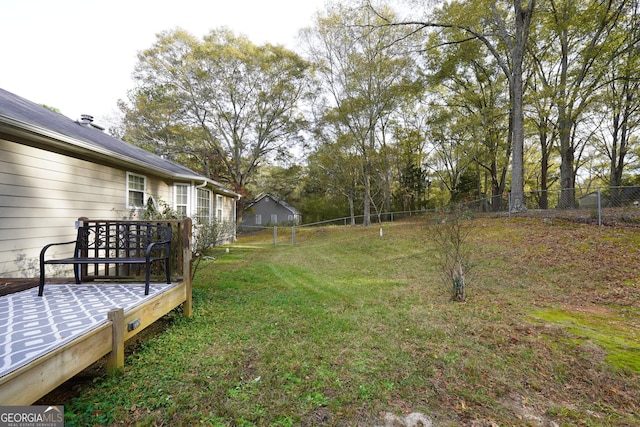 view of yard featuring a wooden deck