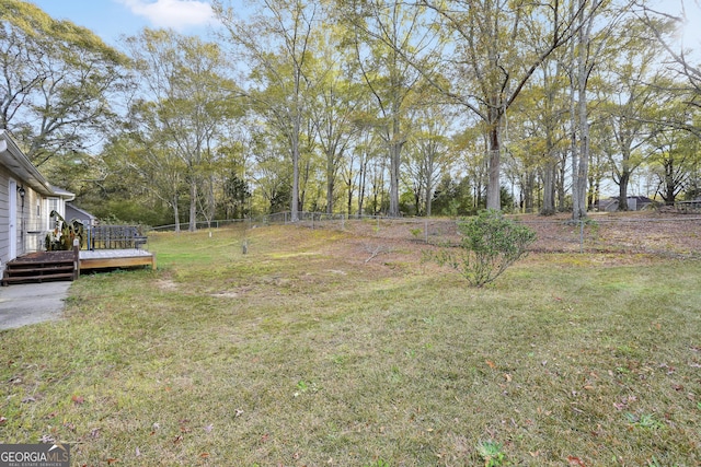 view of yard featuring a wooden deck