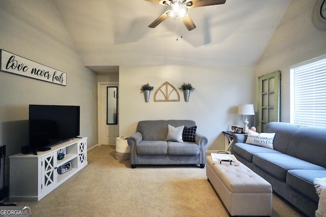 carpeted living room with vaulted ceiling and ceiling fan