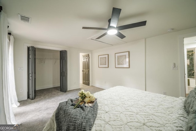 carpeted bedroom with a closet and ceiling fan