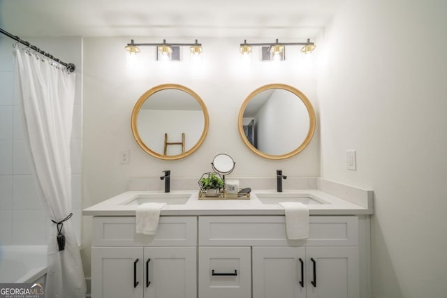 bathroom featuring vanity and shower / bath combo with shower curtain