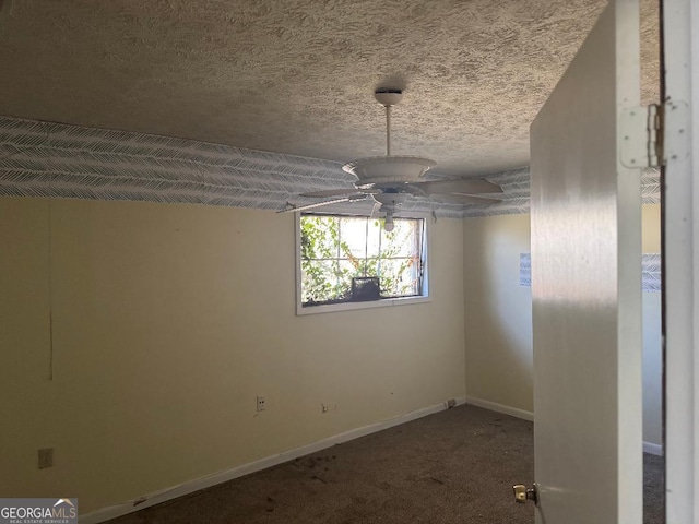 empty room featuring carpet, a textured ceiling, and ceiling fan