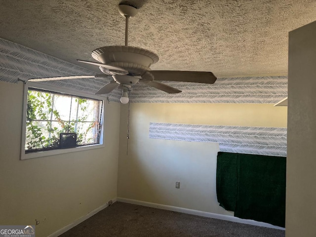 carpeted empty room with ceiling fan