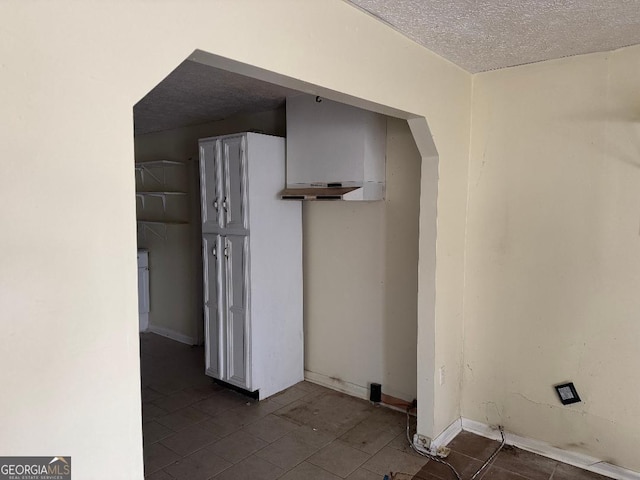 laundry room featuring a textured ceiling