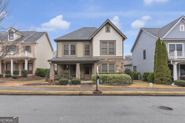 view of front of property with central AC and covered porch