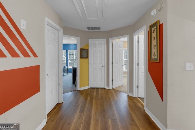 corridor featuring hardwood / wood-style floors