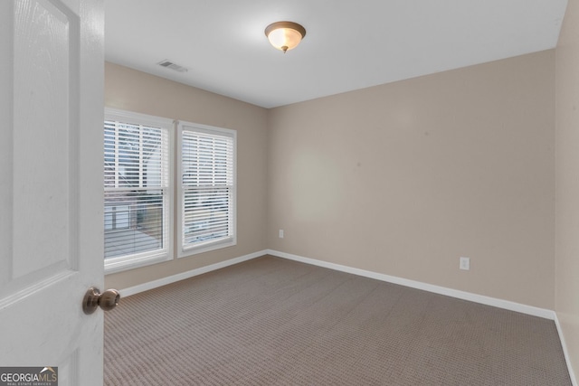 view of carpeted spare room