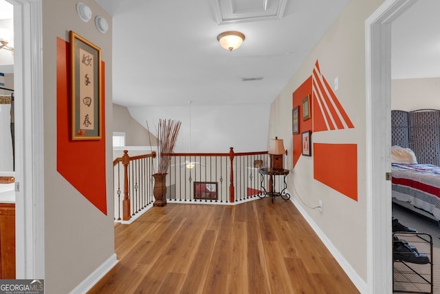 hall with light hardwood / wood-style floors