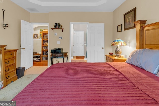 bedroom featuring a tray ceiling