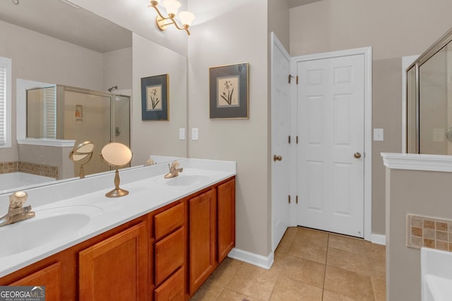 bathroom featuring tile patterned flooring, vanity, separate shower and tub, and an inviting chandelier