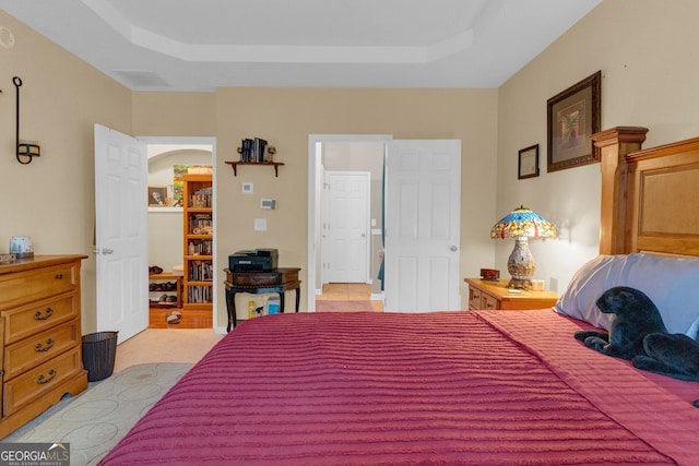 bedroom featuring a tray ceiling