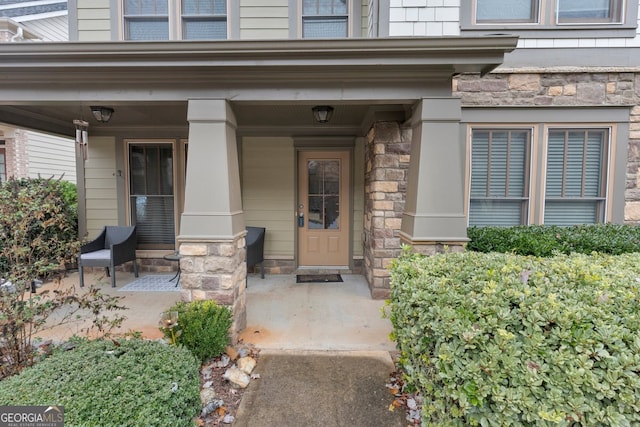 entrance to property featuring covered porch