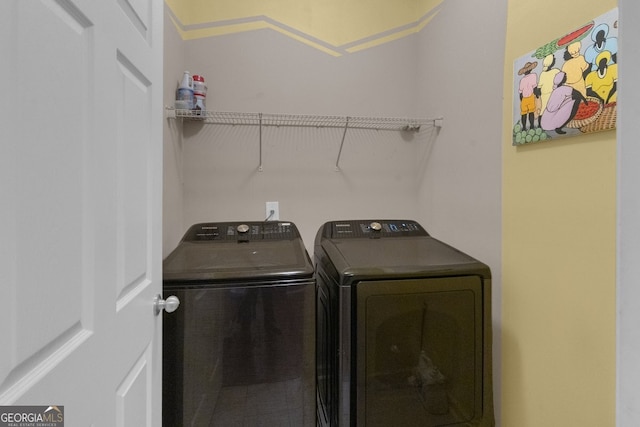 laundry room featuring washing machine and dryer