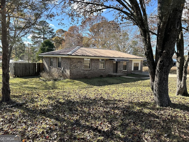 back of property featuring a yard