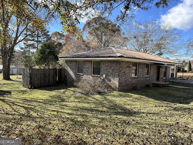 view of home's exterior with a lawn